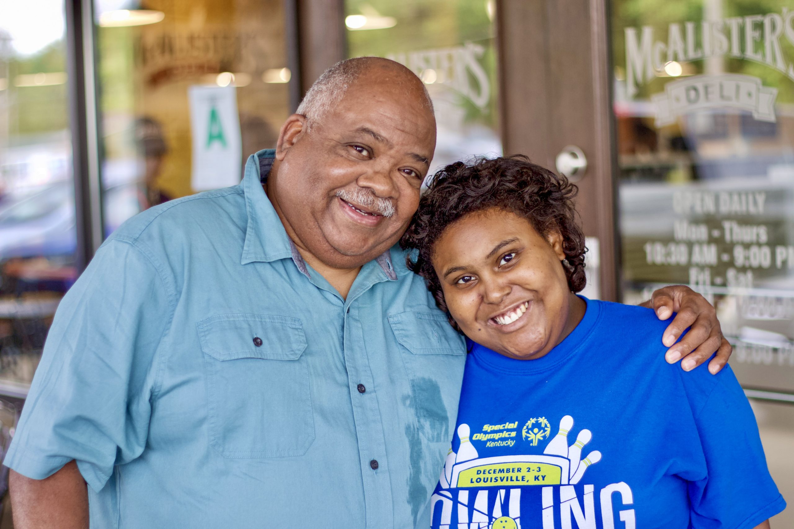 George Campbell (left) with his daughter, Jamesha Maddox, in front of the restaurant where she works, Louisville, Ky., July 2021.